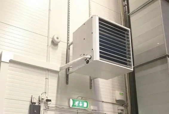 An aero temper fan heater mounted high on a warehouse wall